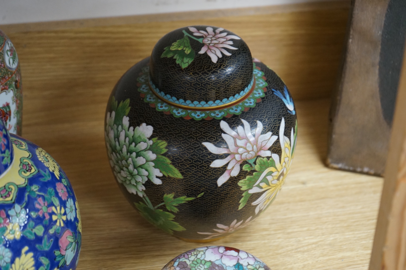 Fourteen pieces of Chinese porcelain and pottery, 19th/20th century to include a pair of blue and white ginger jars, famille rose cup and saucer and a cloisonné pot and cover in the form of an apple, largest 27cm high